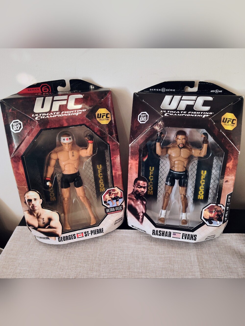 Brand new Georges St-pierre & Rashad Evans figures & 3 UFC cards